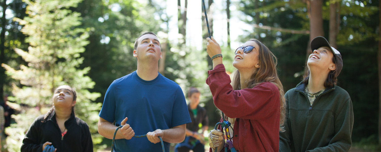 Students belaying at the ropes course