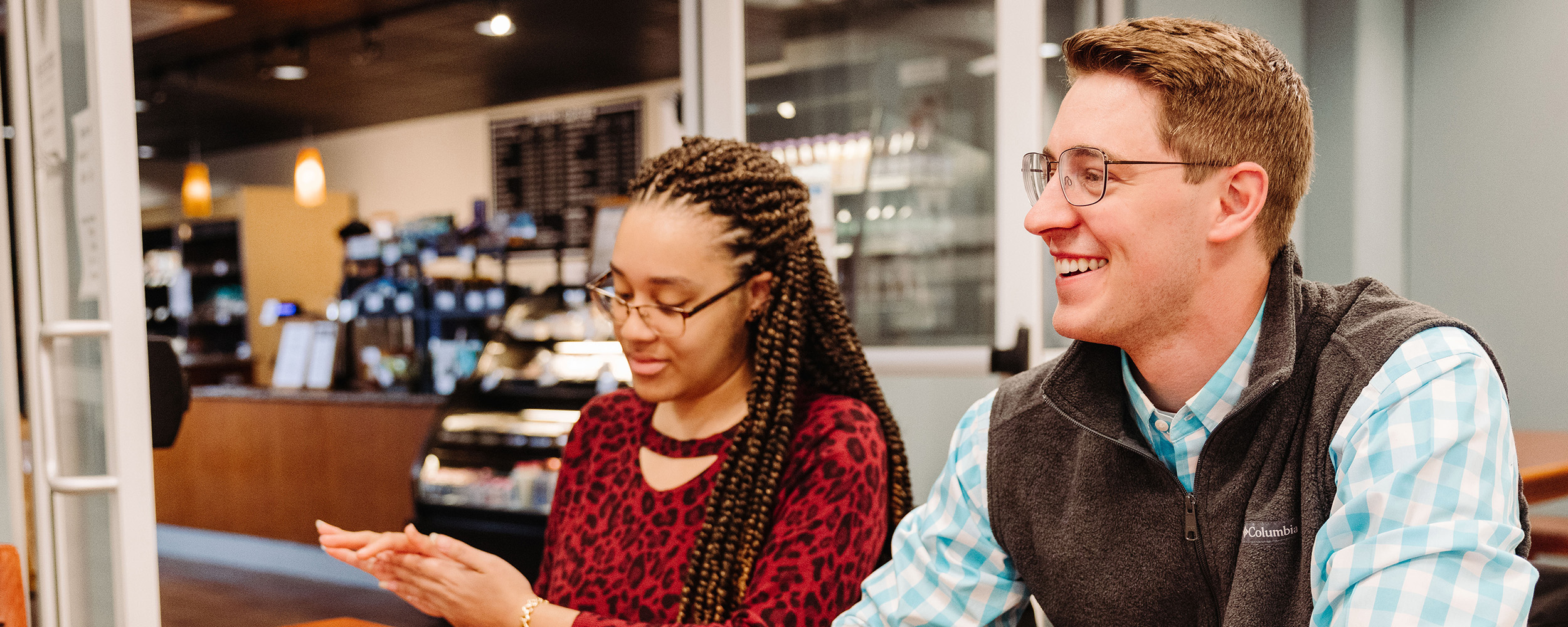 two students sitting next to each other at Gordon College, a North Shore Christian college near Boston