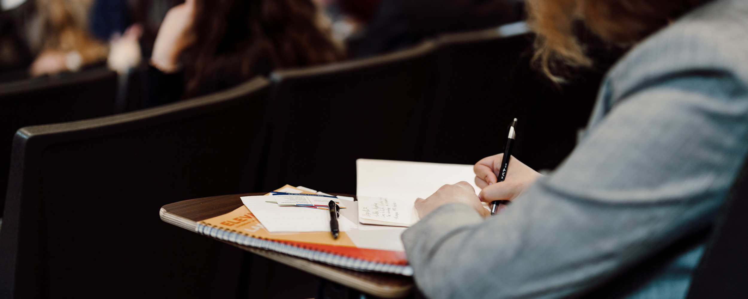 student taking notes in class 