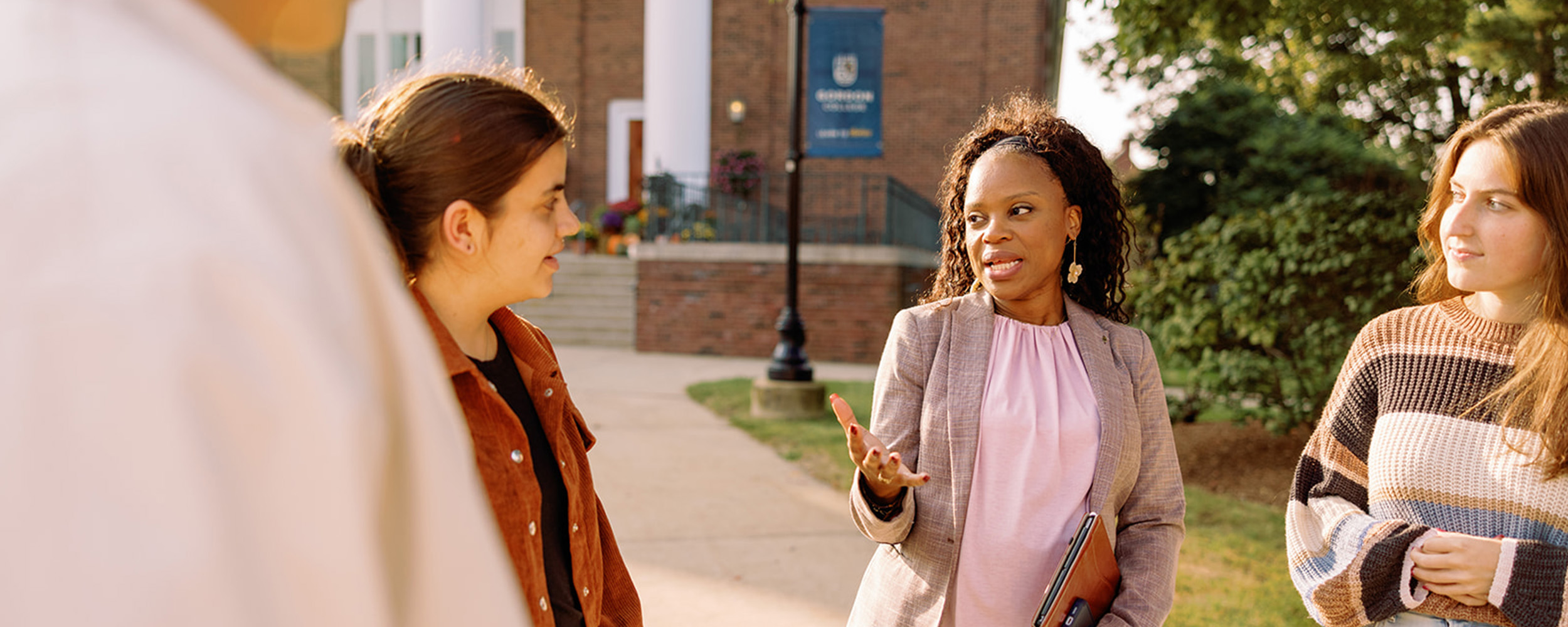 Student and professor talking outside