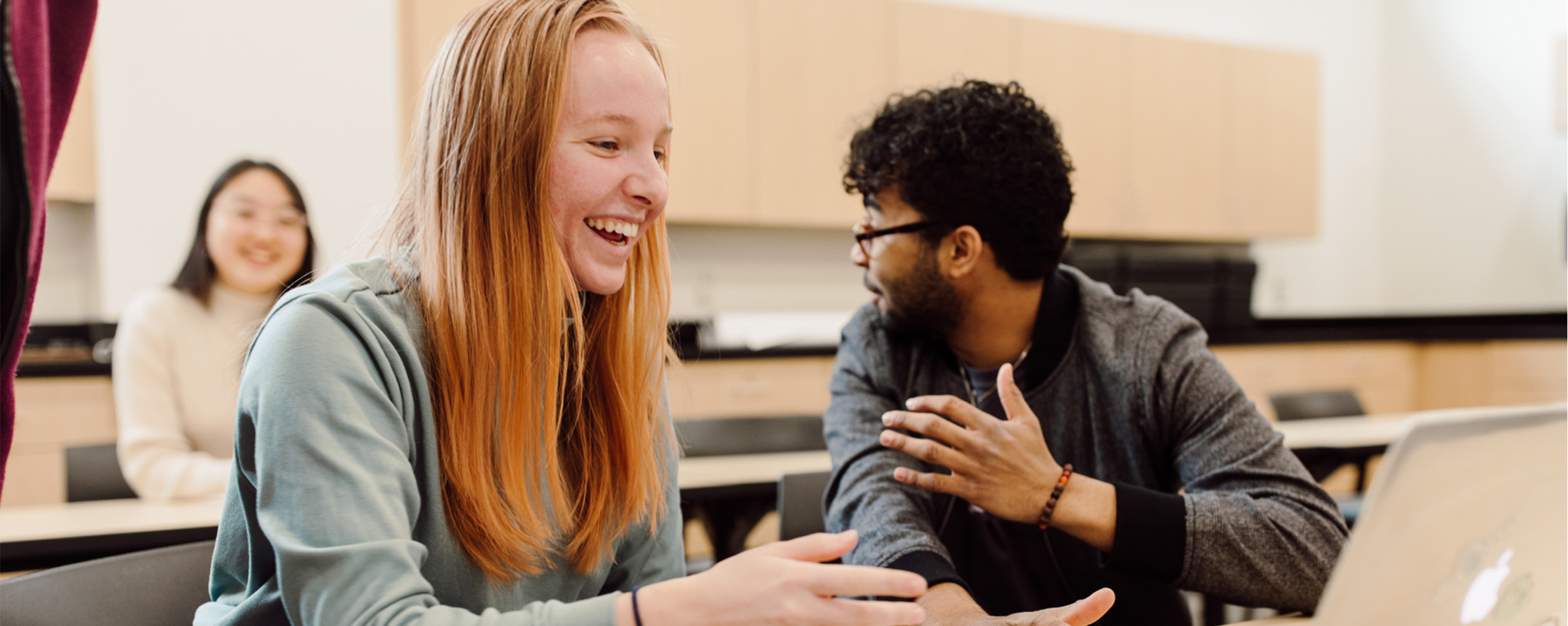 students looking at a laptop