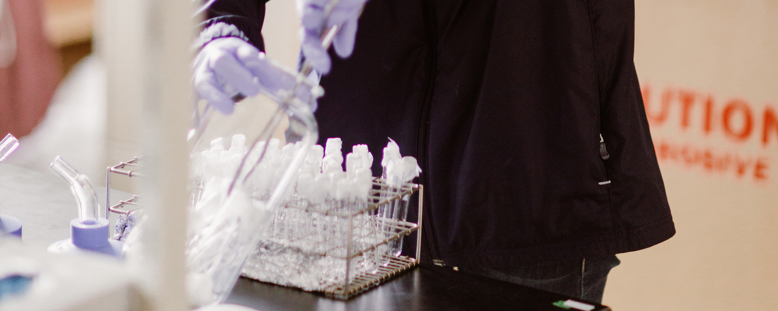 Filling beakers and tubes in lab