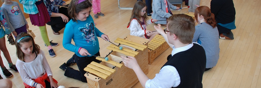 Children playing xylophones