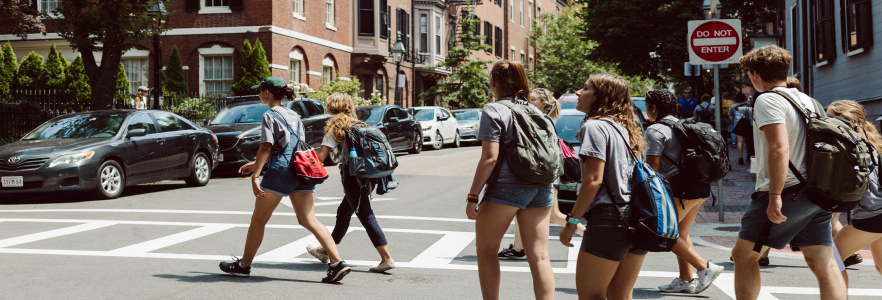 students walking across street in Boston