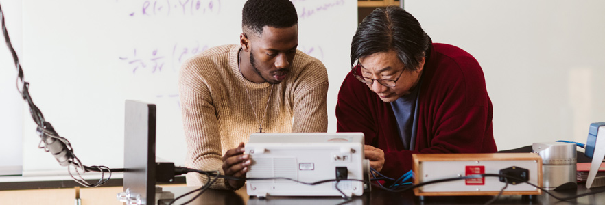 Student working with professor