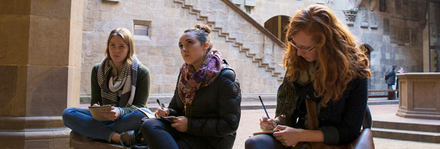 Students drawing in museum