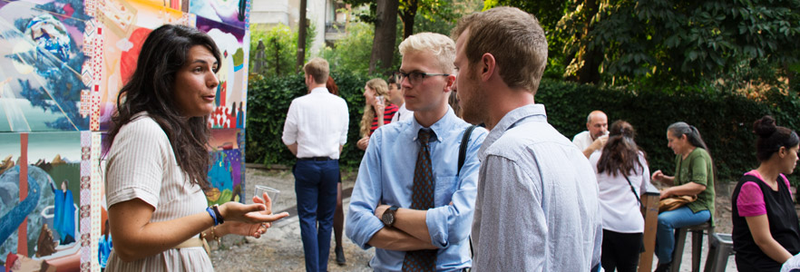 Students at an outdoor art exhibit