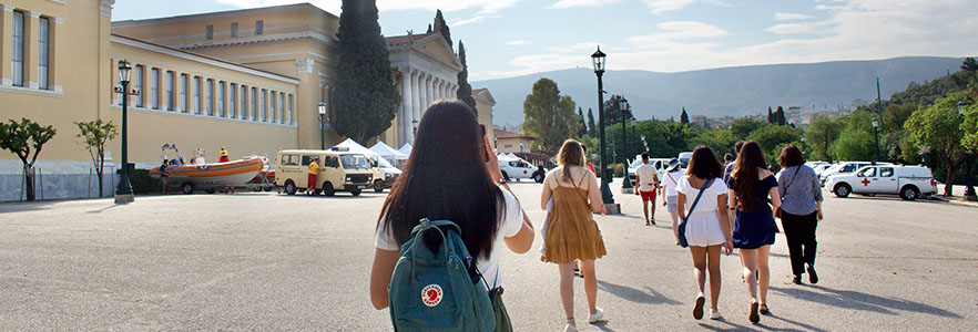 Group of students walking through city of Athens