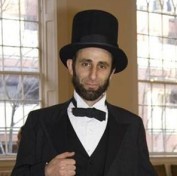 John Sarrouf as Abraham Lincoln