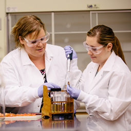 Student and professor in biology lab