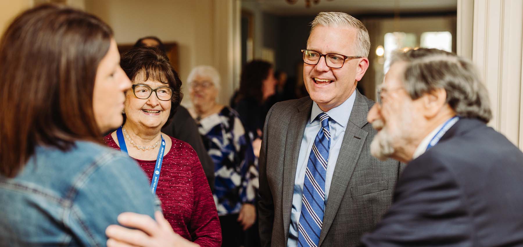 President Mike Hammond chatting with inauguration attendees