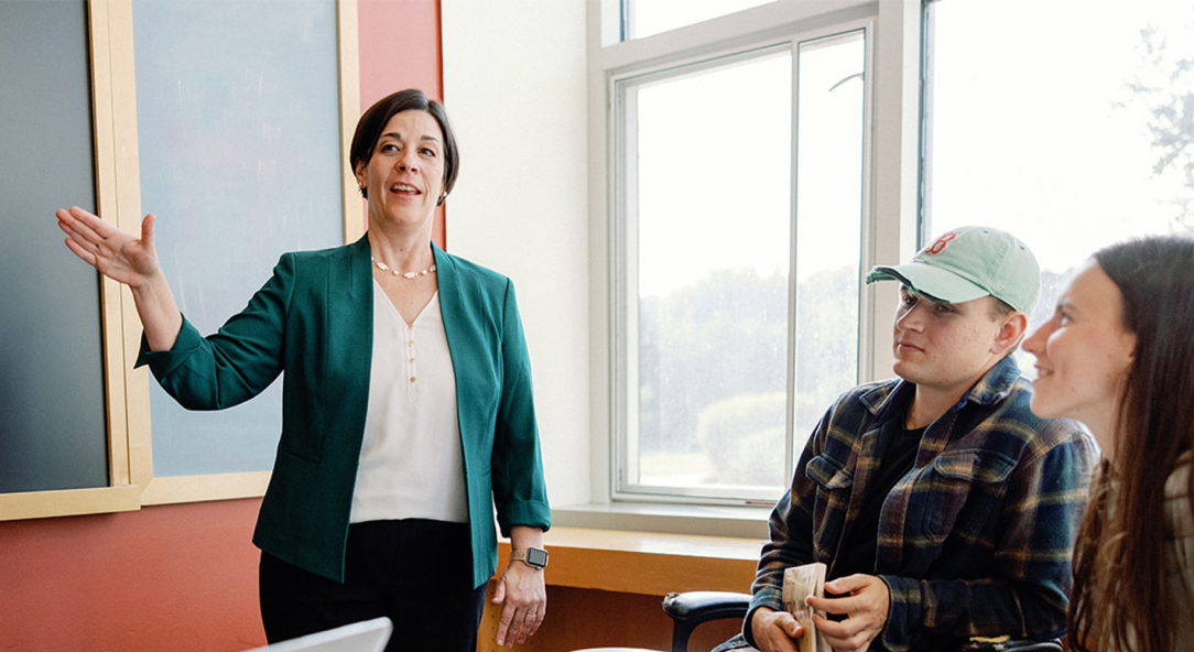 professor teaching students in classroom